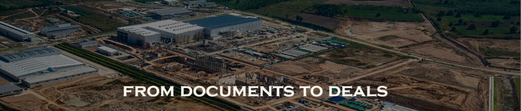 Aerial view of an industrial site featuring large buildings and construction areas, with text overlay reading 'FROM DOCUMENTS TO DEALS'.